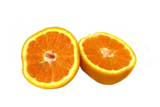 An orange sliced into half isolated on white