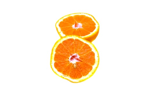 An orange sliced into half isolated on white