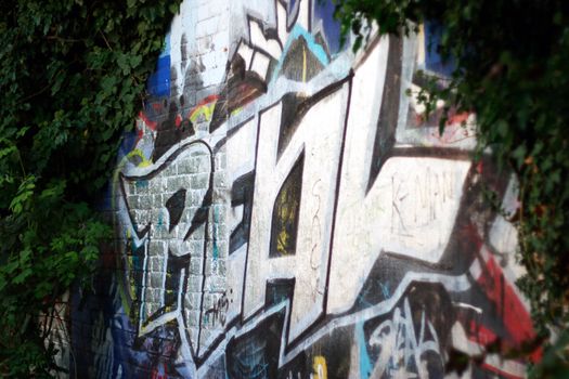 The word "real" as center piece of graffiti vandalism.