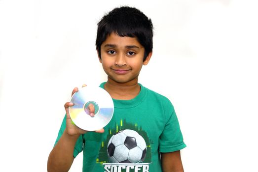 An handsome indian kid holding a compact disc