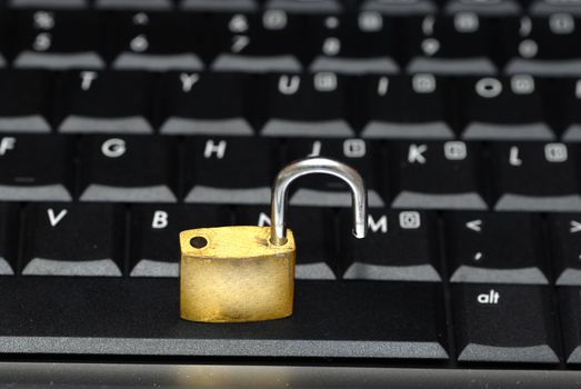 Laptop keyboard and a padlock concept of data security
