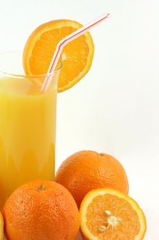 healthy eating glass of orange juice with straw and slice of orange