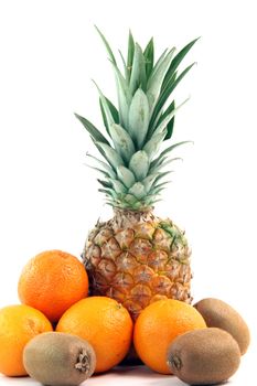 fruits oranges kiwi and ananas isolated on white background agriculture and healthy eating