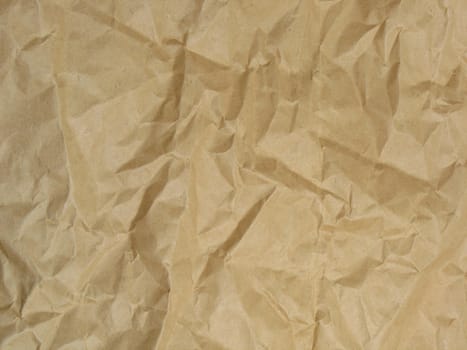 Structure of a crushed brown paper. Background. 
