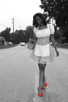 Modern Day Dorothy, desaturated with red ruby shoes