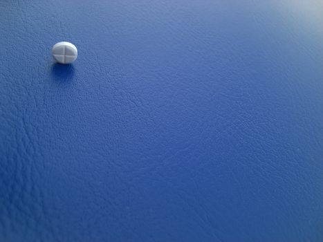 pill on blue background