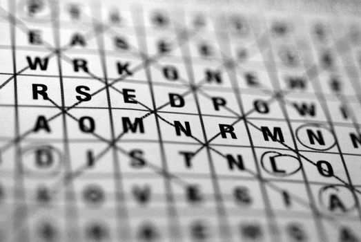 A wordsearch puzzle close-up in black and white