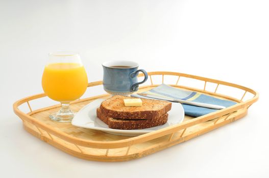Simple breakfast of toast, coffee and juice.