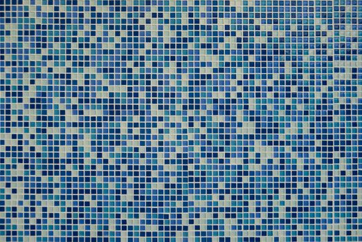 a background of blue mosaic tiles