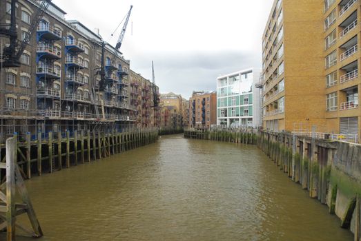 Houses in London dockland. All facing a water channel.