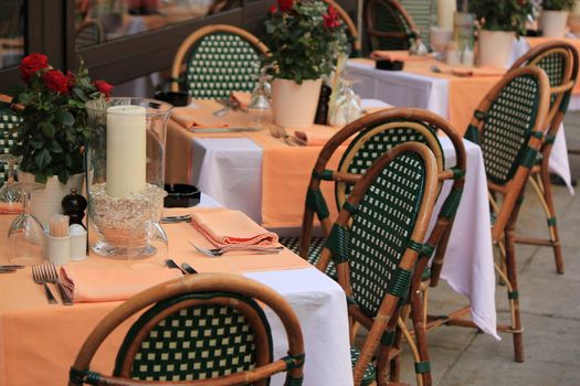 Tables and chairs of restaurant in the street