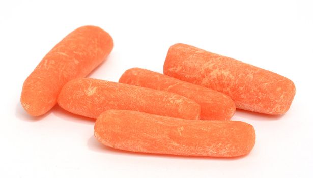 Baby carrots on white background
