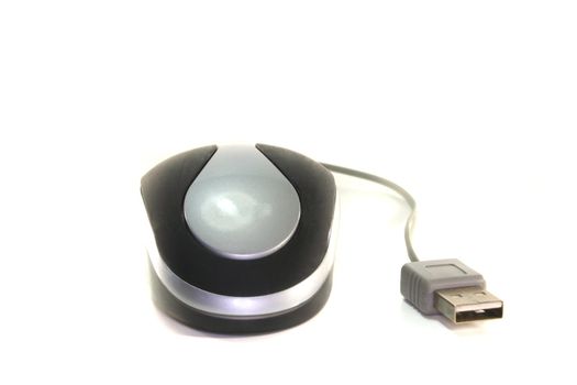 Computer mouse of a laptop with a USB port on a white background