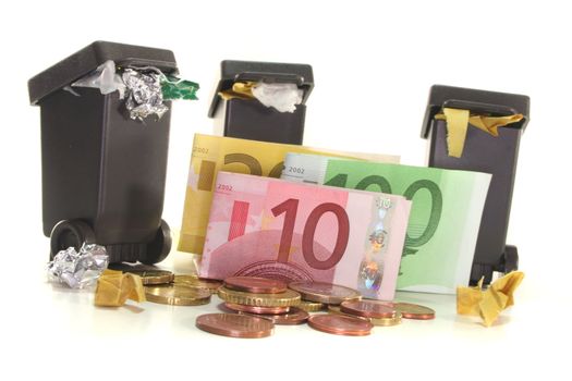 full garbage cans with Euro notes and Euro coins on white background