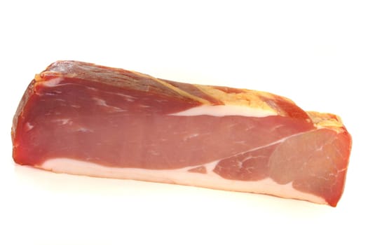 smoked bacon with the rind on a white background