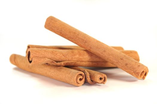 some brown cinnamon sticks on a white background