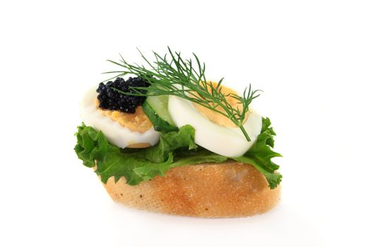 a baguette slice of boiled egg and caviar
