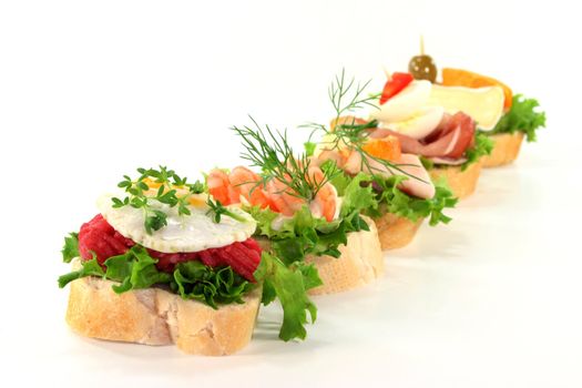 different colored Canapes on a white background