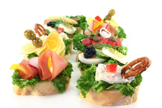 different colored Canapes on a white background
