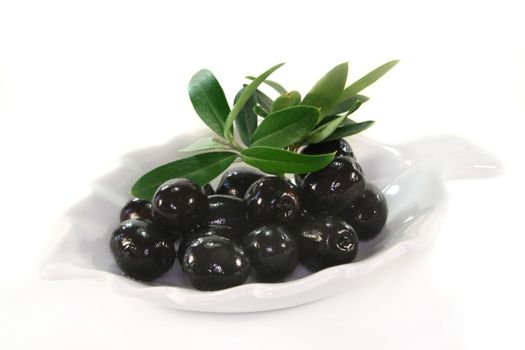 Olives and olive branch on a white background