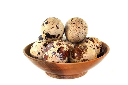 a couple of quail eggs on a white background
