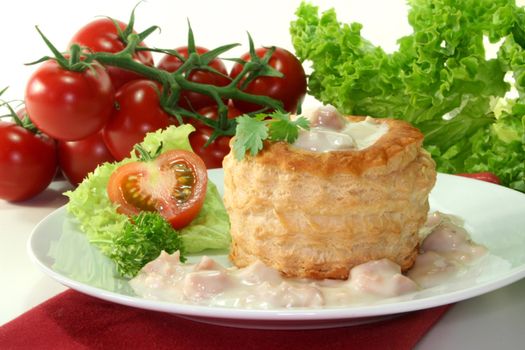 Queen pie filled with meat sauce and fresh herbs
