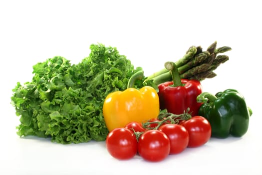 different varieties of fresh vegetables on white background