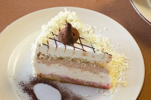 tasty cake at white plate closeup photo