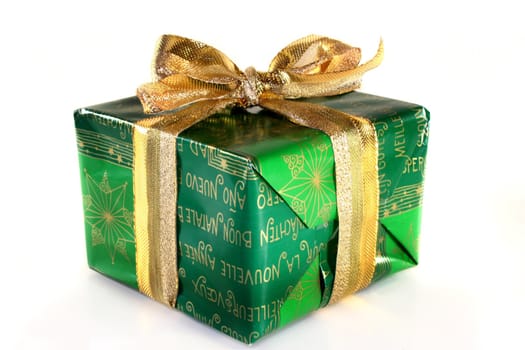 a green Christmas gift on a white background