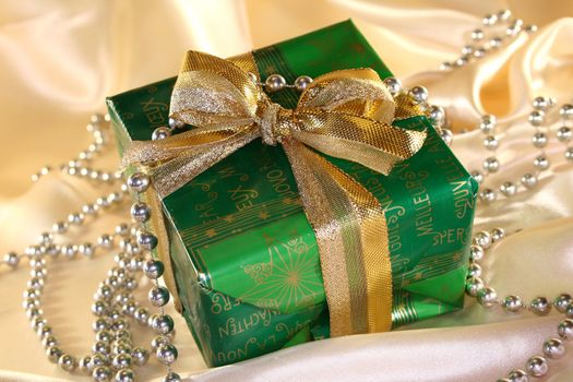 Christmas gifts on Christmas fabric and pearl necklace