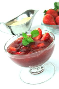 Red fruit jelly with strawberries and sauce Vanilli