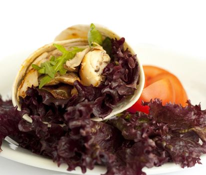 Delicious wrap filled with grilled chicken and colorful lettuce