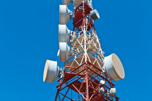 Communications tower with a beautiful blue sky