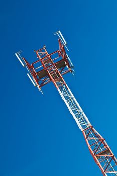 Communications tower with a beautiful blue sky