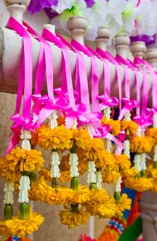 Garland with real and fake flowers with vivid colors
