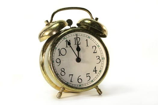 old alarm clock with bells on white background