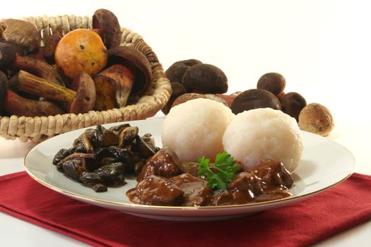 Venison goulash with dumplings and fresh mushrooms