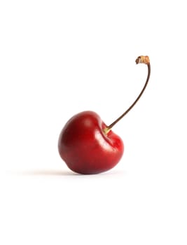 One cherry with stem on white background. Clipping path is included