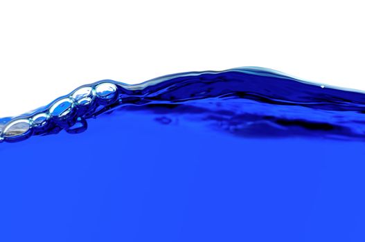 Blue water with air bubbles in the water line. Focus on the water line.