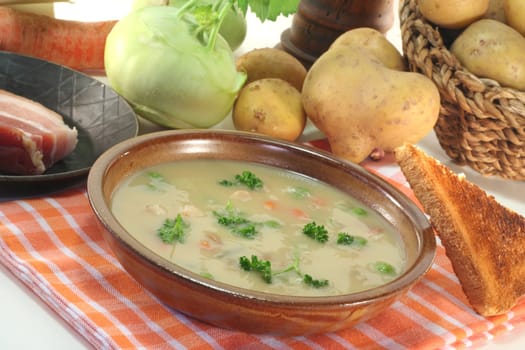 Potato soup with fresh parsley and bacon