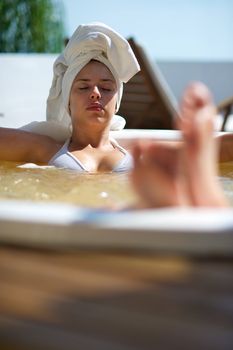 Woman relaxing in a jacuzzi in a resort in Porto Belo, Santa Catarina, Brazil