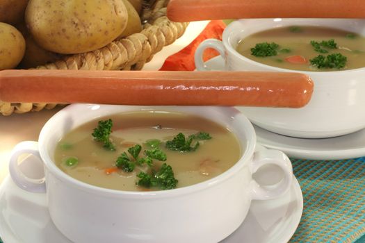 Potato soup with fresh parsley and Wiener sausage