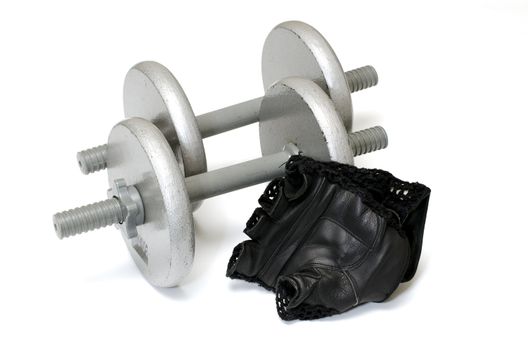 Two dumbbells with workout gloves isolated on white background.