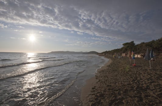 Sun light reflection on the beach in Tuscany, Italy.