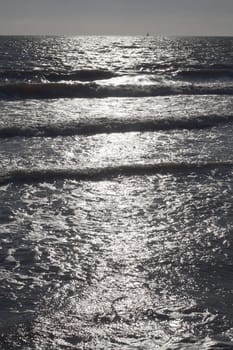 Sun light reflection on the beach in Tuscany, Italy.