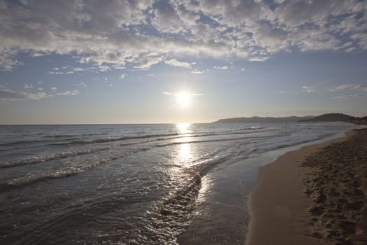 Sun light reflection on the beach in Tuscany, Italy.