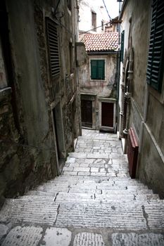 Narrow and old street in Sibenik city, Croatia, medieval zone