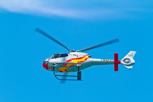 CADIZ, SPAIN-SEP 11: Helicopters of the Patrulla Aspa taking part in an exhibition on the 4th airshow of Cadiz on Sep 11, 2011, in Cadiz, Spain