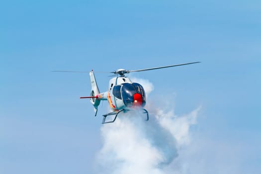 CADIZ, SPAIN-SEP 11: Helicopters of the Patrulla Aspa taking part in an exhibition on the 4th airshow of Cadiz on Sep 11, 2011, in Cadiz, Spain