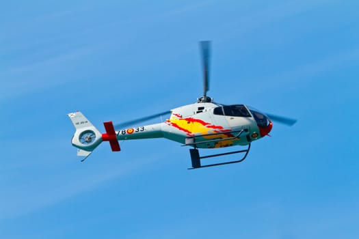 CADIZ, SPAIN-SEP 11: Helicopters of the Patrulla Aspa taking part in an exhibition on the 4th airshow of Cadiz on Sep 11, 2011, in Cadiz, Spain